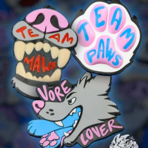 Pile of 3D printed Team Maws, Team Paws and Vore Lover furry badges with Good Girl and Good Boy furry collar accessory bones for furry nametag from DirtyDogs.eu